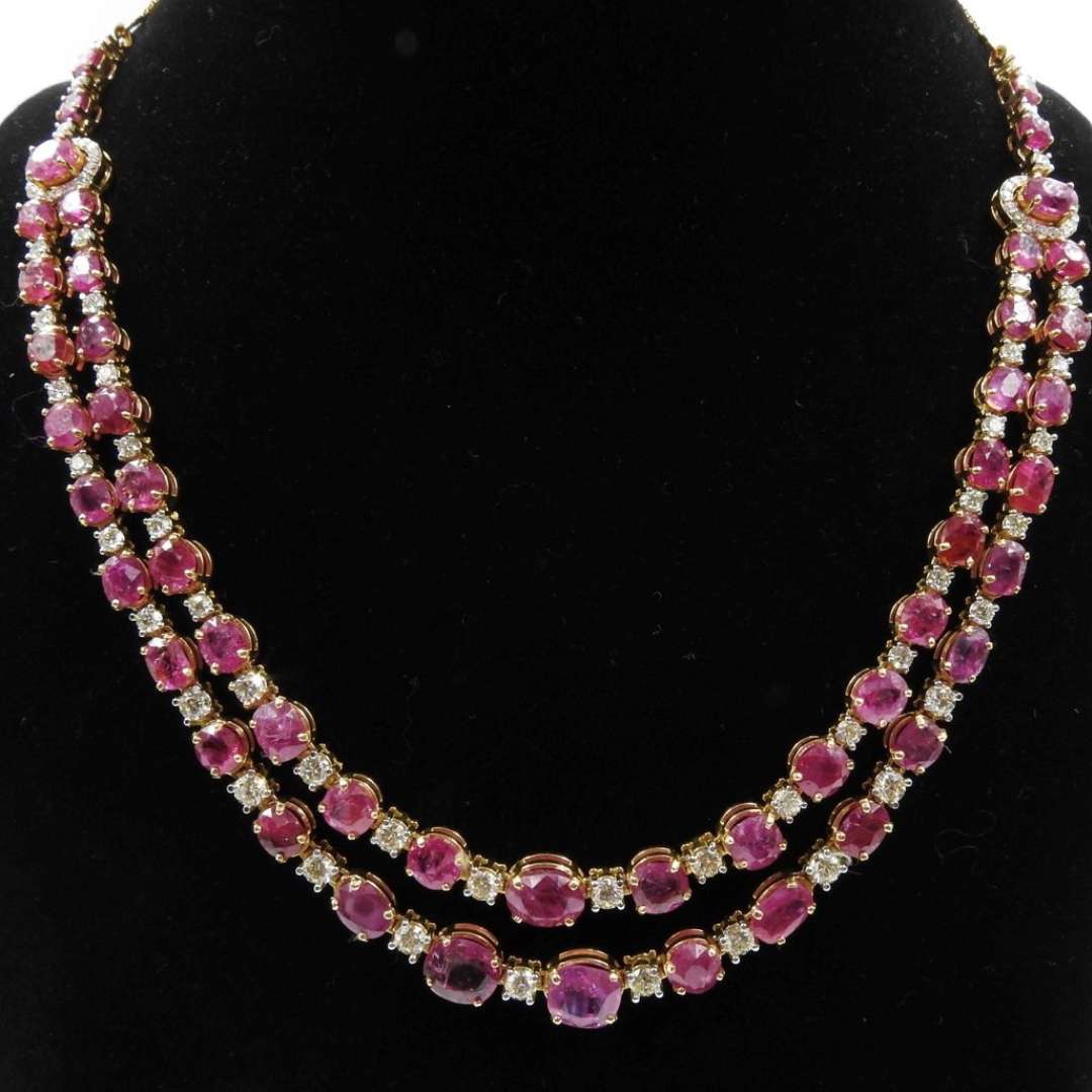 Necklace of Burma Rubies and Solitaires in gold.