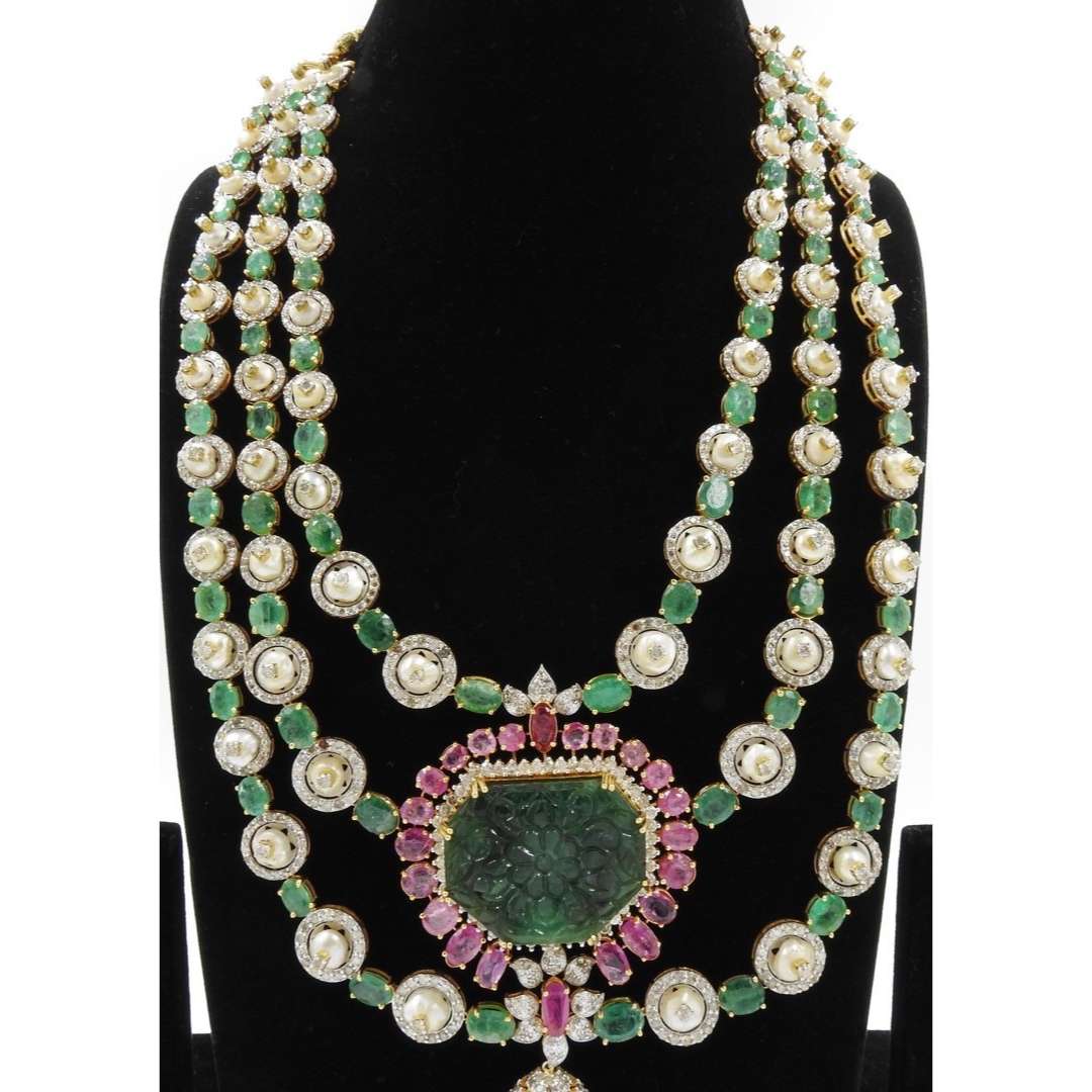 Zambian Emeralds,Burma Rubies,Basra Pearls and Diamonds in Gold.